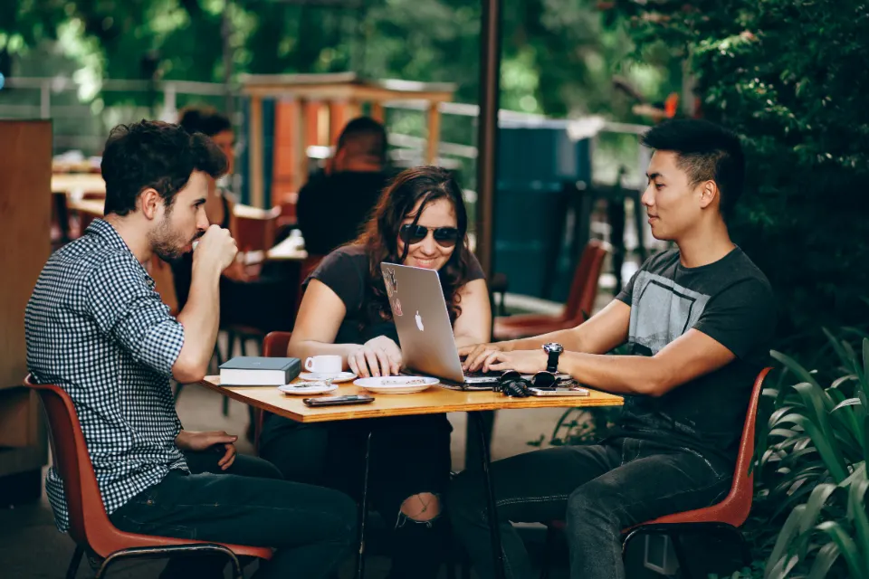 Students working together at a café table